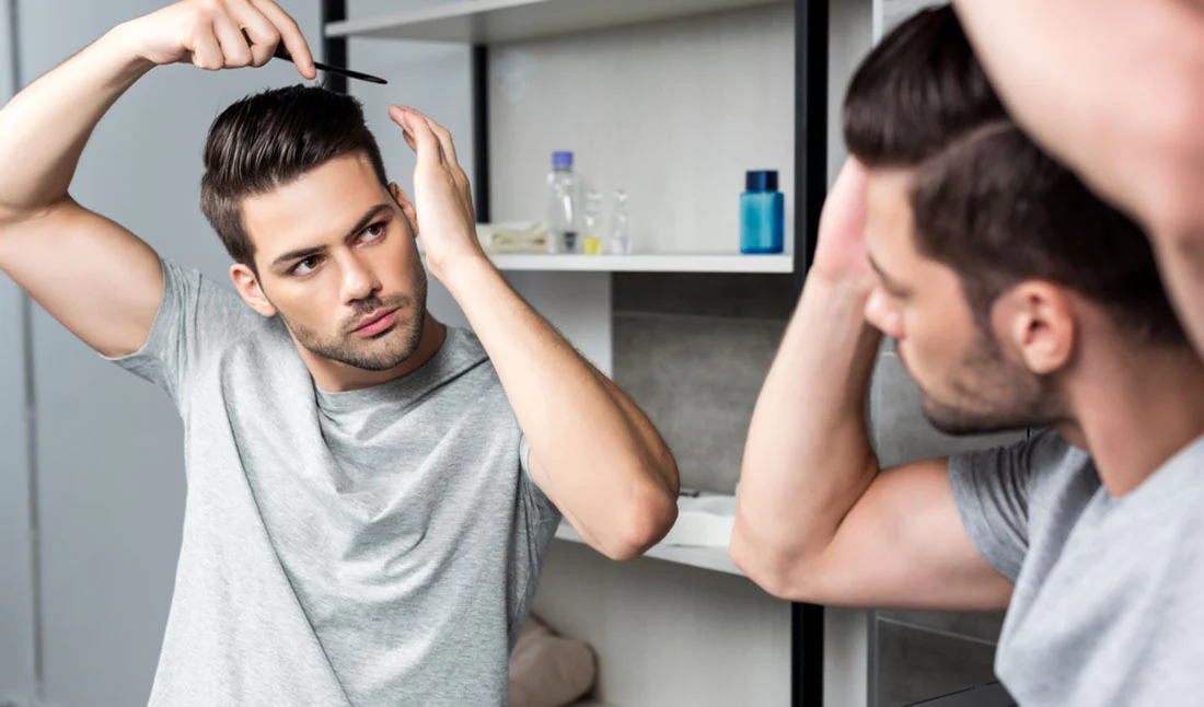 Man demonstrating hair styling tips